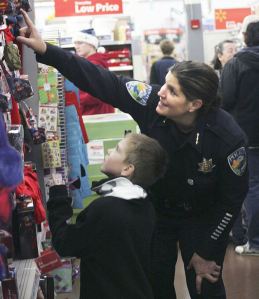 Maple Valley Police Chief Michelle Bennett points out the options to Logan Winegar