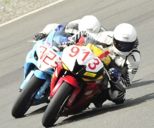 Tom Ahearne leans into a turn during a WMRRA race. The club hosts its Sounds of the Past event this weekend.