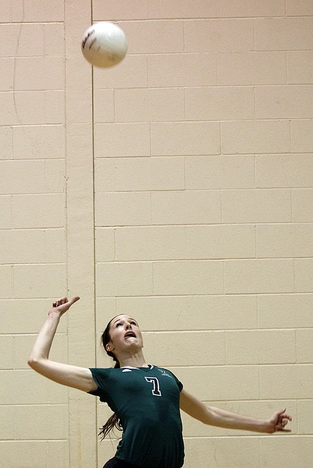 Kentwood’s Lauren Hacket winds up to serve against Kentridge in the district tournament Nov. 8.