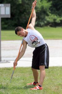Tahoma’s Denhma Patricelli stretches prior to competing at the Youth World Trials. He won his age group and set a record.