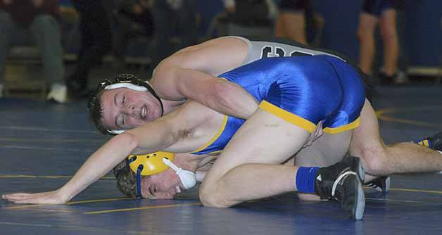 Kentwood's Dalton Meyers works to score points against Tahoma's Justin Weiding in the 145 pound match during a dual meet between the Conquerors and the Bears Dec. 18. Meyers won 8-0.