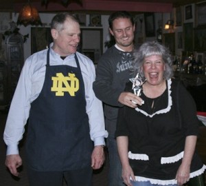 Ginger “Mama” Passarelli wins the spaghetti throw down Monday at her Black Diamond restaurant over Tom Kasper. Kelly Snodgrass presents the award.