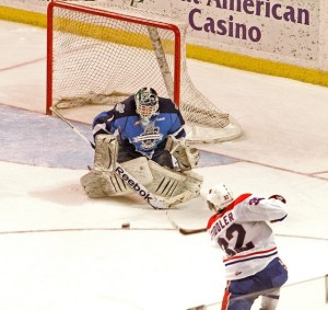 Seattle Thunderbird Calvin Pickard blocks the shot from Spokane Chiefs' Todd Fiddler