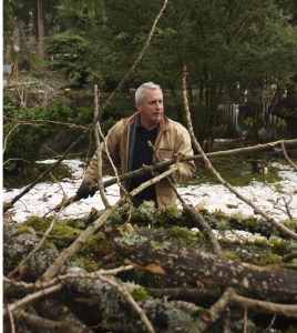 Randy Payne cleans up the downed branches at his Lake Sawyer home Saturday