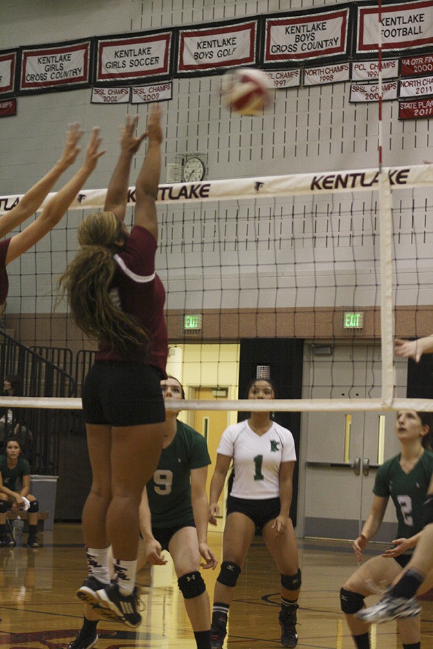Kentlake junior Ryleigh Burdick attempts to block a hit from Kentwood during Monday’s game. The Conks remain undefeated with a 3-0 record after beating the Falcons 3-2. Kentlake is 0-2 overall.