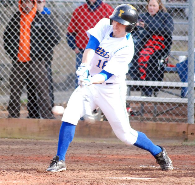 Tahoma's John Bodenhammer makes contact late in the game against Kentlake on Thursday. Tahoma won 3-2.
