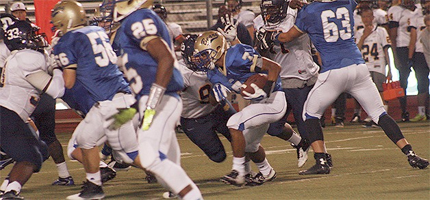Tahoma junior Caleb Brown looks for a hole in the defense against Decatur on Sept. 26. The Bears stormed back from a first half deficit for a 28-21 win
