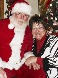 Santa Claus spends some time with Leih Mulvihill Saturday in Black Diamond.