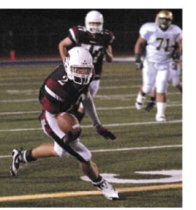 Kentlake wide receiver Cody Arp takes in a pass and looks to gain more yardage last Friday against Auburn. Arp pulled in five receptions for 54 yards in a 42-7 loss to the fifth-ranked Trojans.
