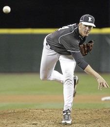Kentwood's Avery Kain hurls the ball at a Richland batter during the Class 4A state championship game on May 29