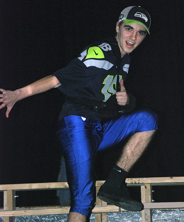 Tahoma junior Mickey Bergsma strikes a pose during the runway walk portion of the Mr. Tahoma pageant Jan. 17. The competition featured 15 juniors and seniors competing for the title. The event was Madison Johson and Kelsey Anderson’s senior project. It was a fundraiser for Maple Valley-based nonprofit Wings of Karen.