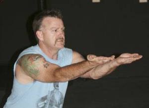 Brian Dotson displays various yoga techniques during his class at the Maple Valley Creative Arts Center Tuesday.