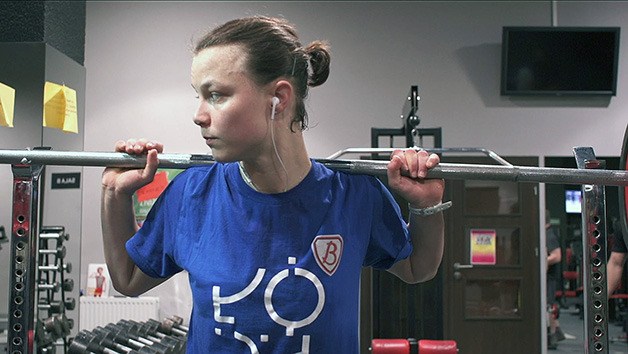 Kentlake graduate Courtney Thompson lifts weights in February 2013 while she played for a professional volleyball team in Portland. Thompson is the focus of a documentary released in December. It was produced by Jack and Leslie Hamann of Seattle as part of the NCAA Division I volleyball Final Four last month.