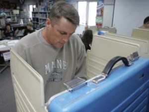 Aleck Warren of Maple Valley votes in the general election Tuesday at Glacier Park Elementary School.