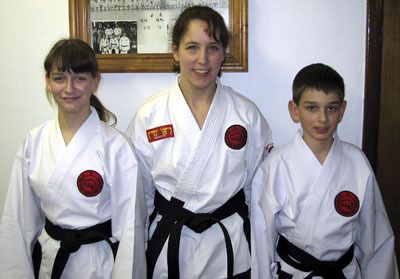 Brother and sister Nick and Emily Huber of Maple Valley recently earned Tae Kwon Do black belts.