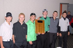 Kentwood boys golf team with their title plaque (left to right): Spencer Kim