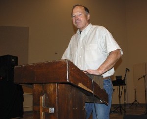 Pastor Roy Conwell stands behind the pulpit inside of the recently completed church on Kent Kangley Road.