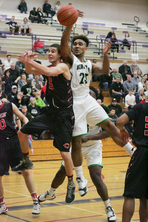 Senior forward Marcus LuBom jumps for the ball during Saturday’s regional game against Camas at Puyallup High School.