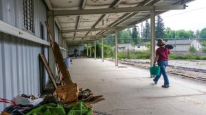 Volunteers help clean the old driving range Tuesday at the former Elk Run Golf Course to make way for the future storage space for the Elk Run Farm.