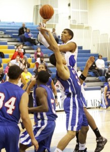 Tahoma’s Christian Behrens hits a short jumper during a double overtime win over Kent-Meridian Tuesday.