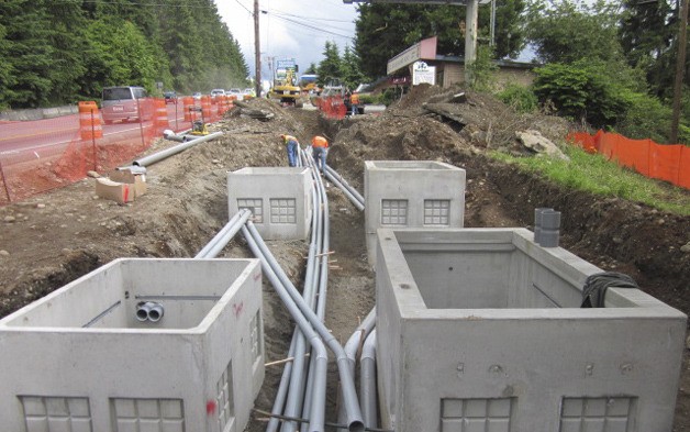 Construction workers on state Route 169 near Witte Road installing underground utilities. The improvement project is currently on schedule
