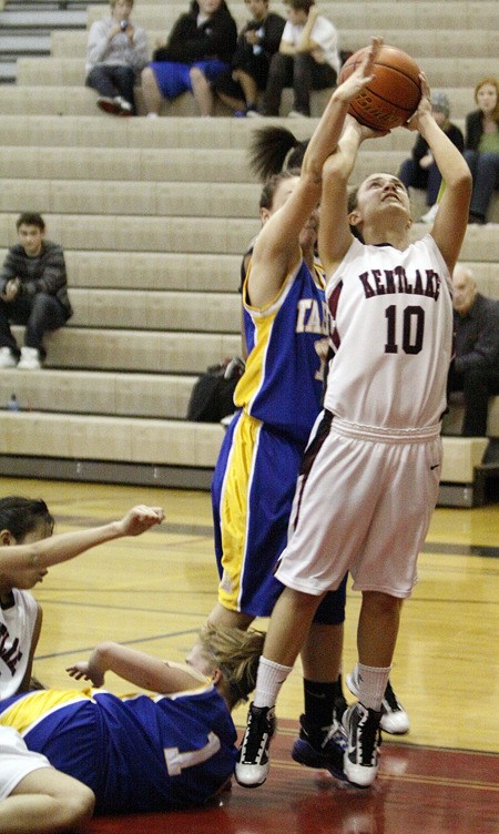 Kentlake's Erin Hunt (10) draws a foul on a layup during a game against Tahoma last season.