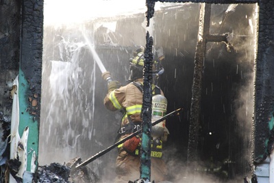 Fire investigators reported this fire in a Kent home was caused by an unattended candle.