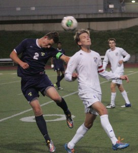 Tahoma’s Logan Wood heads the ball Friday at home against Todd Beamer. The Bears won 3-0.