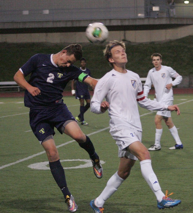 Tahoma’s Logan Wood heads the ball Friday at home against Todd Beamer. The Bears won 3-0.