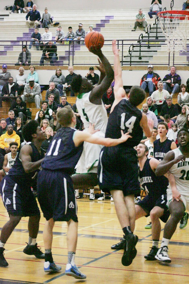 Kentwood senior forward Malik Sanchez drives to the hoop during the game Feb. 14 against Bellarmine. The Conquerors won 67-59.