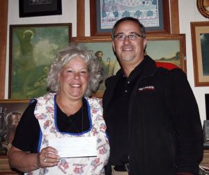 Ginger Passarelli Senecal holds the $5