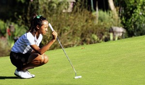 Kentwood’s Katelann Soth lines up a putt during a match against Tahoma Sept. 12 at Meridian Valley Country Club. The Conquerors went undefeated in league matches this season.