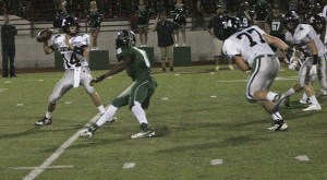 Kentwood quarterback Brian Campbell looks down field for an open player Friday during the Conks’ 35-14 win over Emerald Ridge.
