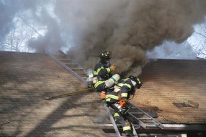Kent Regional Fire Authority firefighters battle a blaze in the 13400 block of Southeast 230 Street Feb. 17. The home was a total loss.