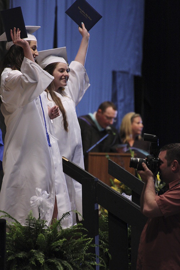A pair of Tahoma High grads celebrate together after receiving their diplomas at the White River Amphitheater on June 12.