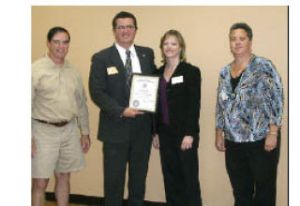 Welcoming Dachelle Pand (second from right) of Valley Bank as a new member of the Rotary Club of Covington are club leaders (from left) Barry Anderson