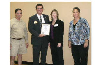 Welcoming Dachelle Pand (second from right) of Valley Bank as a new member of the Rotary Club of Covington are club leaders (from left) Barry Anderson