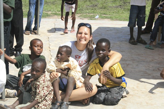 Kathy Taylor is surrounded by students during the school’s Family Fun Day in October. Taylor is a 2008 graduate of Kentlake High and is teaching in Ghana.