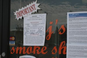 A sign posted outside PJ's Smoke Shack.