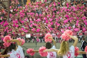 Kentwood cheerleaders lead the roaring crowd at the football game at French Field Oct. 9
