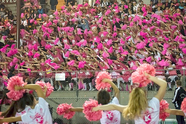 Kentwood cheerleaders lead the roaring crowd at the football game at French Field Oct. 9