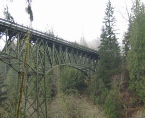 Construction workers were placing rocks in place today at the Green River Bridge