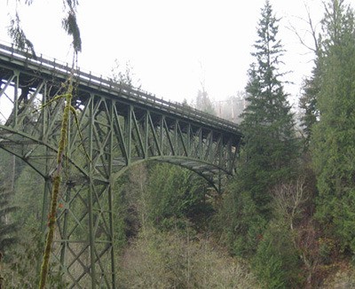 Construction workers were placing rocks in place today at the Green River Bridge