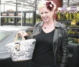 Laura Bingle holds her handbag outside of the Maple Valley Fred Meyer where the attempted theft took place on Tuesday.