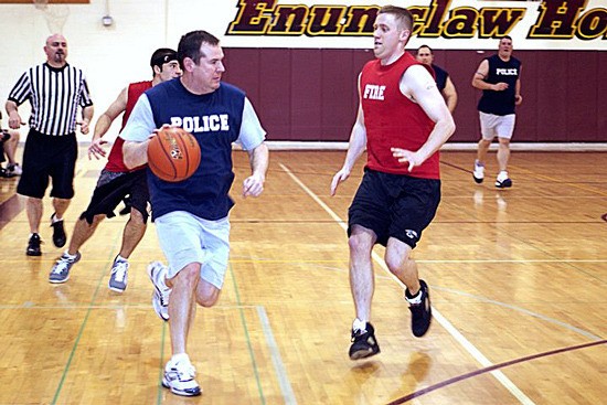Cmdr. Greg Goral with the Black Diamond Police Department plays in a 2010 Boots and Badges charity game.
