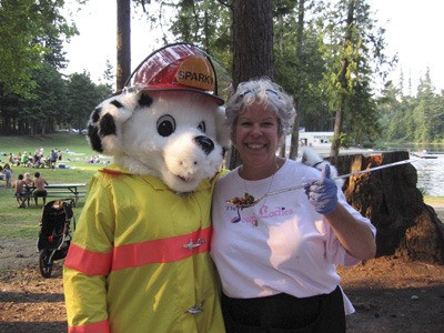 Ginger Passarelli Senecal with Sparky from the Maple Valley Fire and Life Safety at Maple Valley's 2008 National Night Out event.