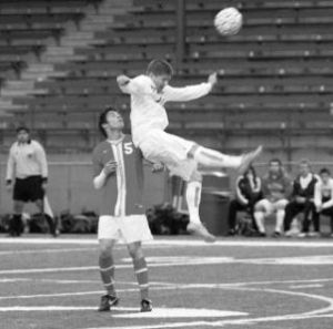 Kentwood’s Michael Fuller (right) battles a Thomas Jefferson defender for a header during Tuesday night’s showdown between the South Puget Sound League North’s Division’s top teams.