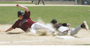 Kentlake’s Brandon Cinkovich (left) couldn’t quite beat the throw to Battle Ground third baseman Willie Bratcher as he was called out on the second-inning play. But everything else pretty much went perfectly for Cinkovich and the Falcons