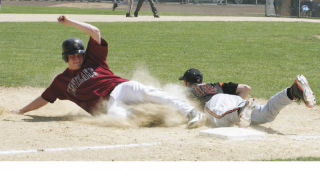 Kentlake’s Brandon Cinkovich (left) couldn’t quite beat the throw to Battle Ground third baseman Willie Bratcher as he was called out on the second-inning play. But everything else pretty much went perfectly for Cinkovich and the Falcons