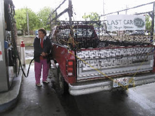 Ronnie Short was the last of 200 customers to receive free gasoline from the Washington State Lottery May 23. Her truck sported the sign signaling the end of the giveaway.